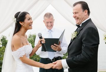 Bride and groom smiling during their Phuket wedding ceremony with Peter Notley
