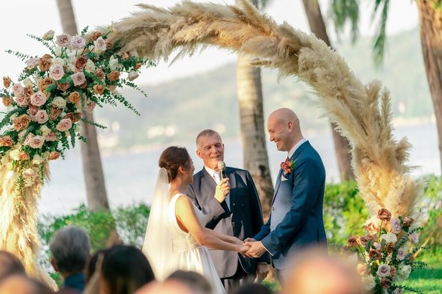 Peter Notley officiating an elegant outdoor wedding ceremony in Phuket