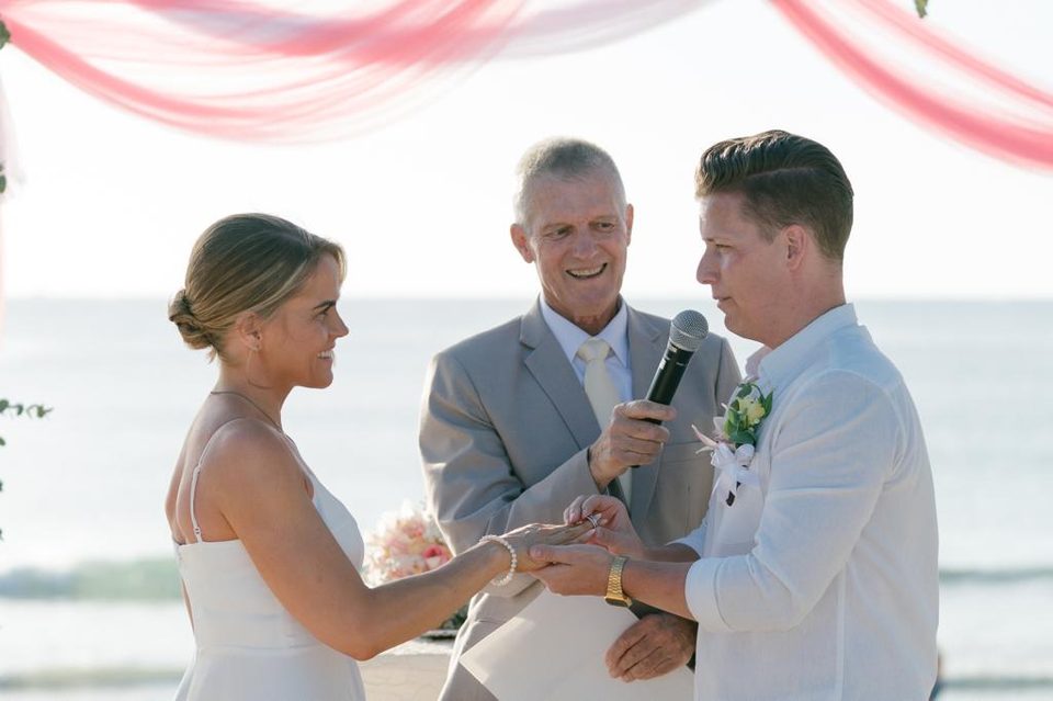 Peter Notley speaking to a couple during a Phuket wedding ceremony