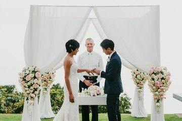 Couple exchanging rings during a Phuket wedding ceremony