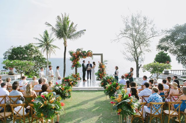 Guests watching a Phuket wedding ceremony beside the sea